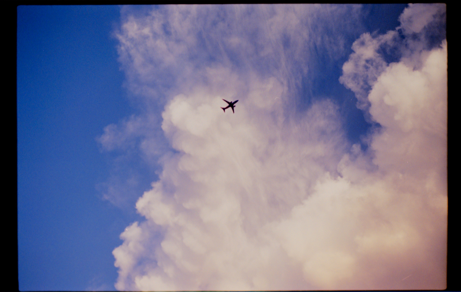 Silhouette of plane in sky